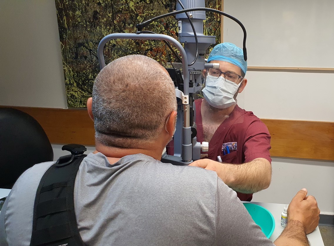 : L. is examined by Dr. Scheyer during his visit to Hillel Yaffe Medical Center’s Ophthalmology Clinic