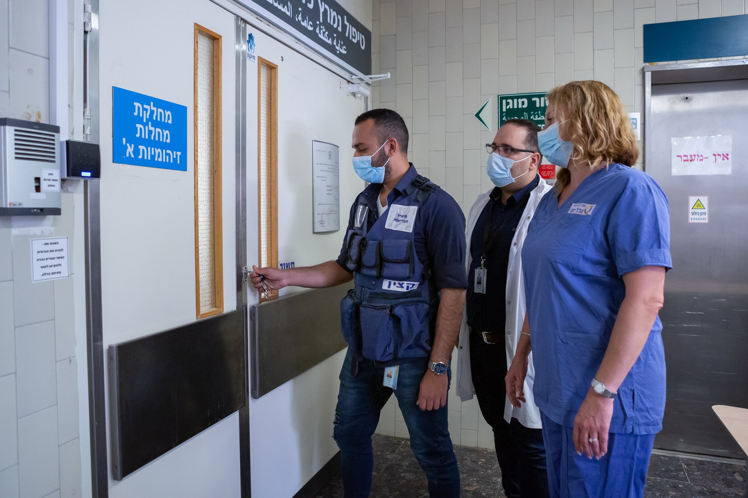 Director of the Infectious Diseases Unit A, Dr. Jamil Mohsen, Head Nurse of Unit, Ms. Oksana Porat, and Deputy Security Officer Motty Hadad, lock the unit