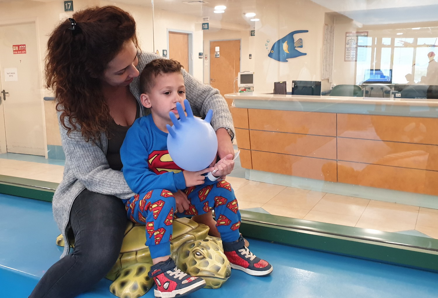 Leroy and his mother, Celine, in the play area of the Department of Pediatrics at Hillel Yaffe